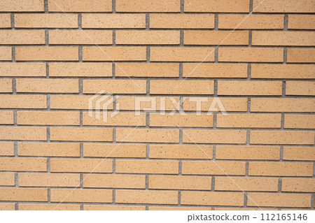 Background wall of yellow bricks closeup. 112165146