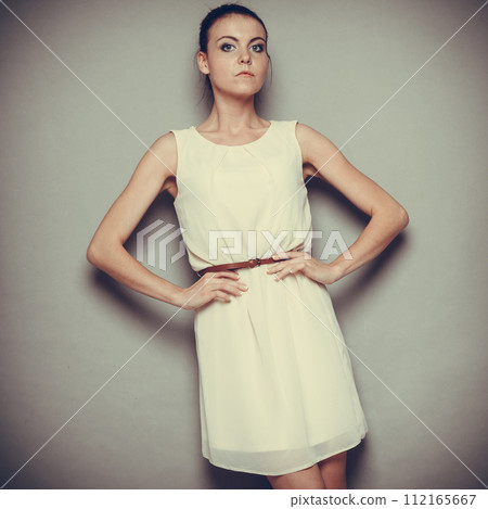Glamour girl in bright dress on gray Glamour girl in bright dress on gray 112165667