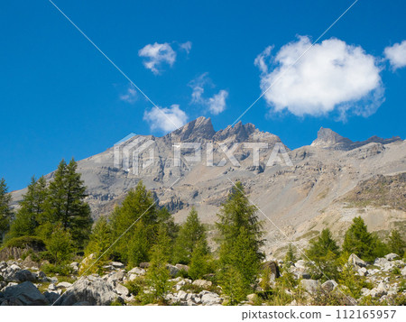 Champery, Switzerland - September 10th 2023: View of Haute Cime peak in the Dent du Midi massif. Champery, Switzerland - September 10th 2023: View of Haute Cime peak in the Dent du Midi massif. 112165957