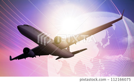 airplane flying against the sun 112166075