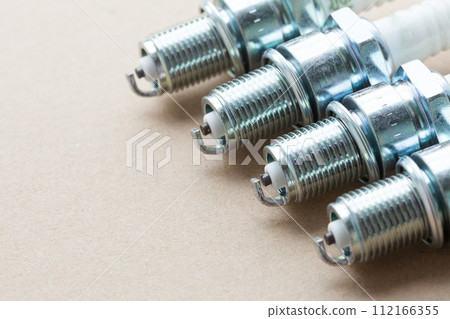 Auto service. Set of spark plugs as spare part of car. Auto service. Set of spark plugs as spare part of car. 112166355