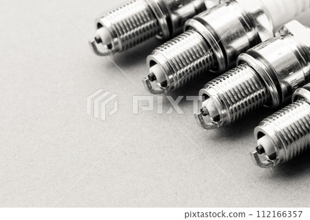 Auto service. Set of spark plugs as spare part of car. Auto service. Set of spark plugs as spare part of car. 112166357