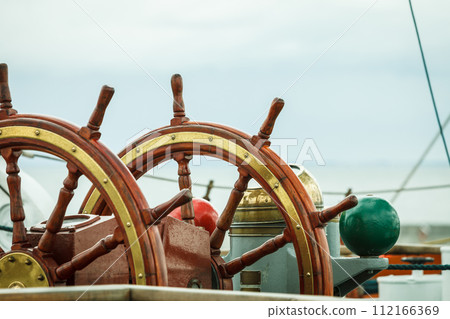 Closeup of helm rudder on ship or yacht Closeup of helm rudder on ship or yacht 112166369