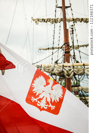 Closeup of polish national flag with emblem Closeup of polish national flag with emblem 112166371