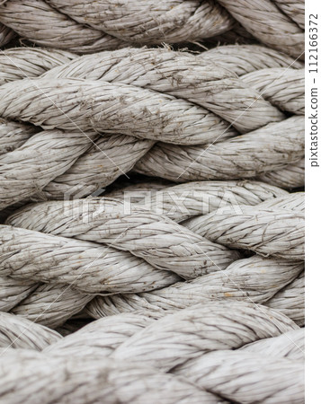 Old fashioned harbor marina sailboat ropes 112166372