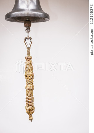 Old fashioned brass bell with rope Old fashioned brass bell with rope 112166378