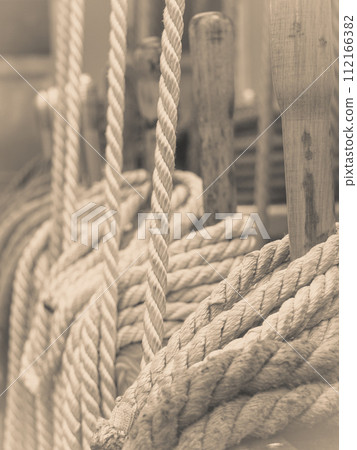 Old fashioned harbor marina sailboat ropes Old fashioned harbor marina sailboat ropes 112166382