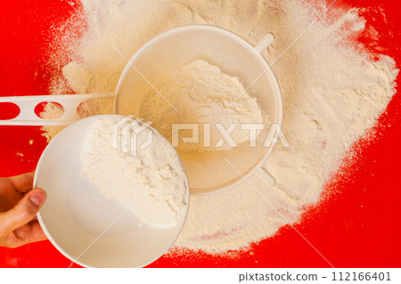 Preparation for baking, ingredients flour sifting. 112166401