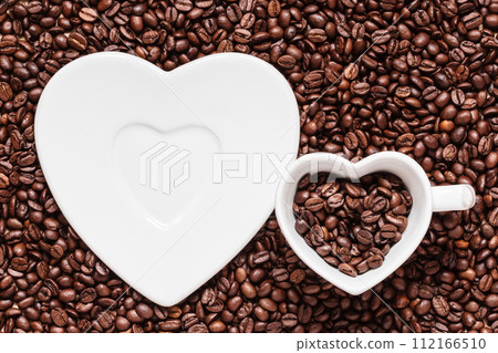 cup and saucer on coffee beans background 112166510