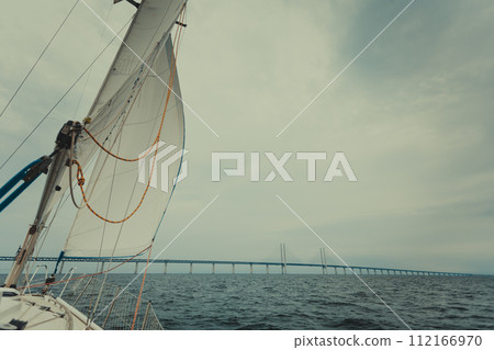 Yacht and oresund bridge between denmark sweden Yacht and oresund bridge between denmark sweden 112166970
