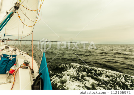 Yacht and oresund bridge between denmark sweden Yacht and oresund bridge between denmark sweden 112166971