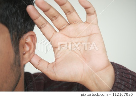 young man having ear pain touching his painful ear , young man having ear pain touching his painful ear , 112167050