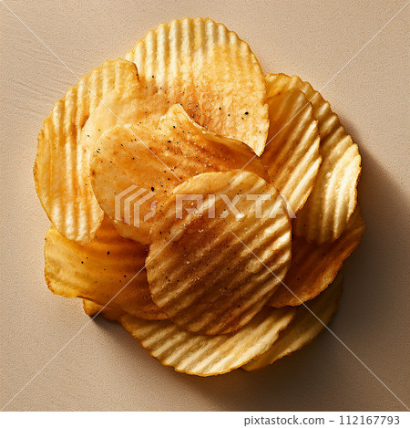 A pile of various crispy potato chips with salt, on upper view A pile of various crispy potato chips with salt, on upper view 112167793