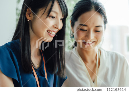 Middle-aged woman receiving coaching Middle-aged woman receiving coaching 112168614