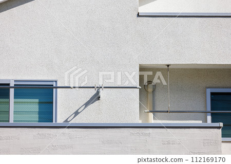 2nd floor balcony of a house with white walls 2nd floor balcony of a house with white walls 112169170