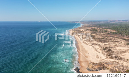 An aerial view of Malhao beach popular for surfing and vacationing tourists. Bird's eye view. 112169547