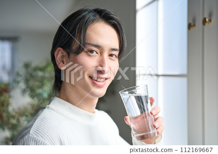 Men drinking water Men drinking water 112169667