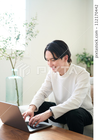 man opening laptop man opening laptop 112170442