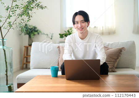 man opening laptop man opening laptop 112170443