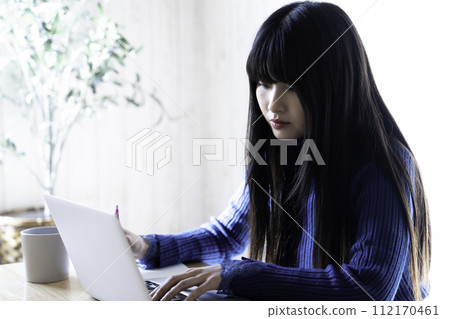 Young woman taking online training Young woman taking online training 112170461