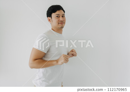 Happy asian bearded man rising his fist, happy fun unconfident dancing posing, looking at camera and standing isolated over white background wall. Happy asian bearded man rising his fist, happy fun unconfident dancing posing, looking at camera and standing isolated over white background wall. 112170965