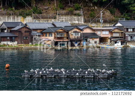 Traditional wooden fishermen boathouses in Ine north Kyoto prefecture on the Sea of Japan 112172692