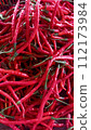 Close up of red curly chili pepper at the market  112173984