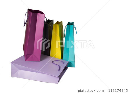 Stack of purple, violet, and magenta fashion bags for event Stack of purple, violet, and magenta fashion bags for event 112174545