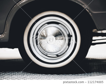 Car tires and wheels displayed in the showroom 112174885