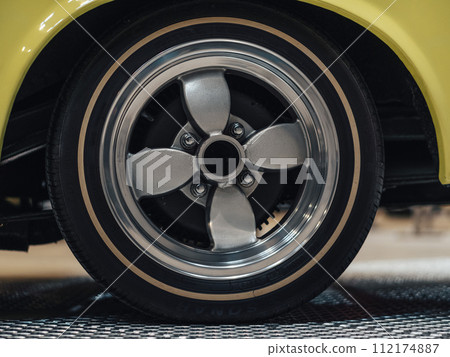 Car tires and wheels displayed in the showroom 112174887