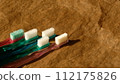 This is a used toothbrush or plastic product whose bristles have spread out. 112175826