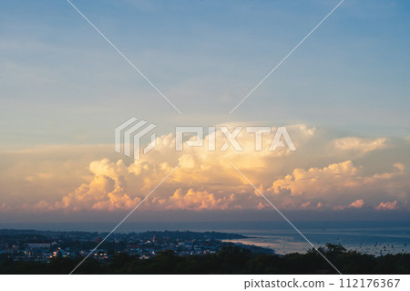 Seascape nature beauty, magic huge cumulus pink orange clouds over blue sea, freedom happiness opportunity 112176367