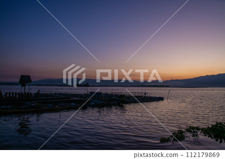 sunset twilight at Kwan Payao, Payao Province in Thailand 112179869