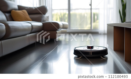 close up of a robotic vacuum glides seamlessly across a polished hardwood floor 112180493