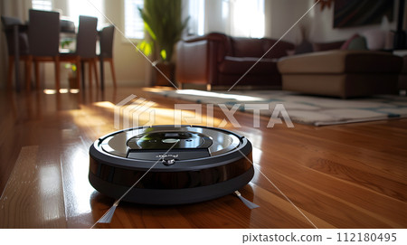 close up of a robotic vacuum glides seamlessly across a polished hardwood floor 112180495