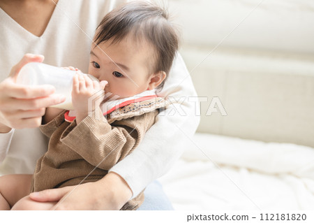 Baby drinking milk 112181820