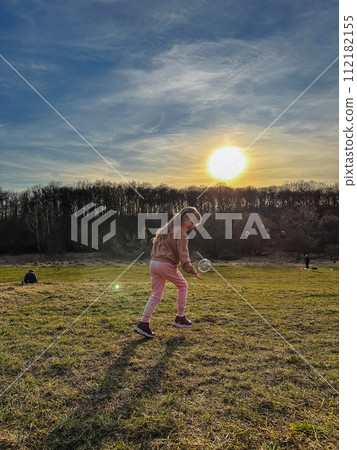 happy toddler girl run by field 112182155