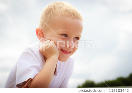 Pensive boy child thinking and daydreaming. 112183442