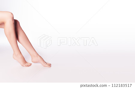 Beautiful well-groomed women's legs close-up on a 112183517
