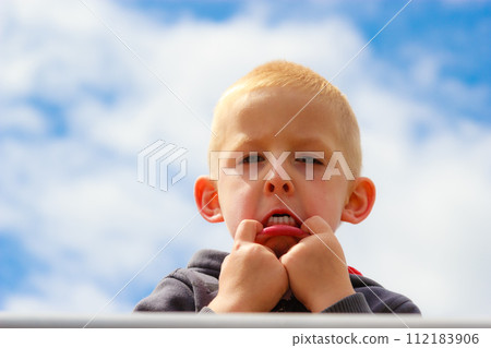 Child kid making silly face. Childhood. 112183906