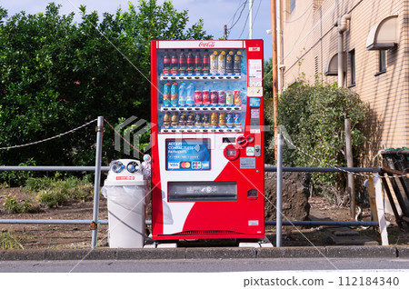 Tokyo, Japan -October  1  , 2023 :  Vending machines in Tokyo, Japan. Coca-Cola vending machine on a residential street 112184340