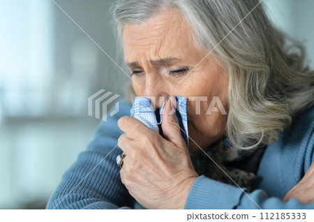 Portrait of sick senior woman at home 112185333