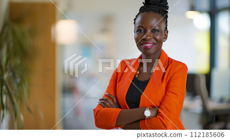 Portrait of a businesswoman with confident and friendly facial expression and her arms crossed in front of blurred office background. Generative AI 112185606