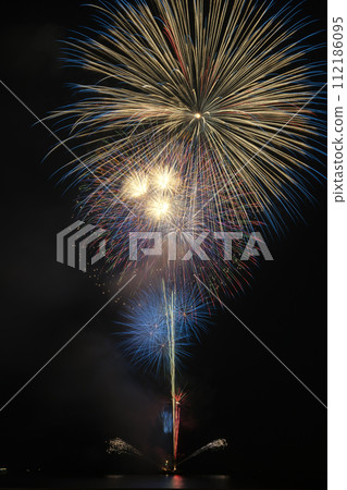 fireworks launching over the sea 112186095