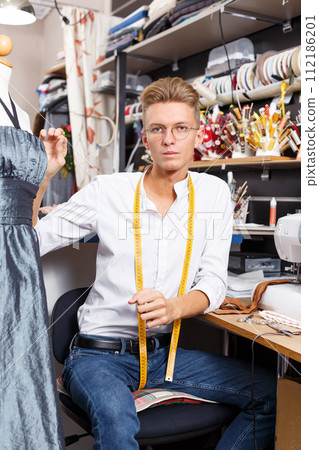 Portrait of blond male dressmaker 112186201