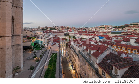 Panorama showing Alfama and Baixa districts of Lisbon aerial day to night timelapse, Portugal 112186304