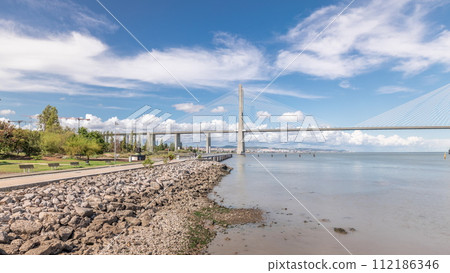 Panorama showing the Vasco da Gama Bridge timelapse in Lisbon, Portugal Panorama showing the Vasco da Gama Bridge timelapse in Lisbon, Portugal 112186346