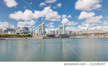 Panorama showing Parque das Nacoes or Park of Nations district timelapse in Lisbon, Portugal. Panorama showing Parque das Nacoes or Park of Nations district timelapse in Lisbon, Portugal. 112186347