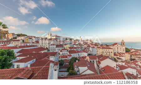 Panorama showing aerial view of Alfama in Lisbon timelapse during sunset. Panorama showing aerial view of Alfama in Lisbon timelapse during sunset. 112186358