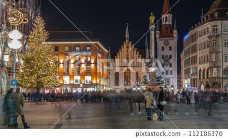 Marienplatz with the old Munich town hall and the Talburg Gate night timelapse, Bavaria, Germany. Marienplatz with the old Munich town hall and the Talburg Gate night timelapse, Bavaria, Germany. 112186370